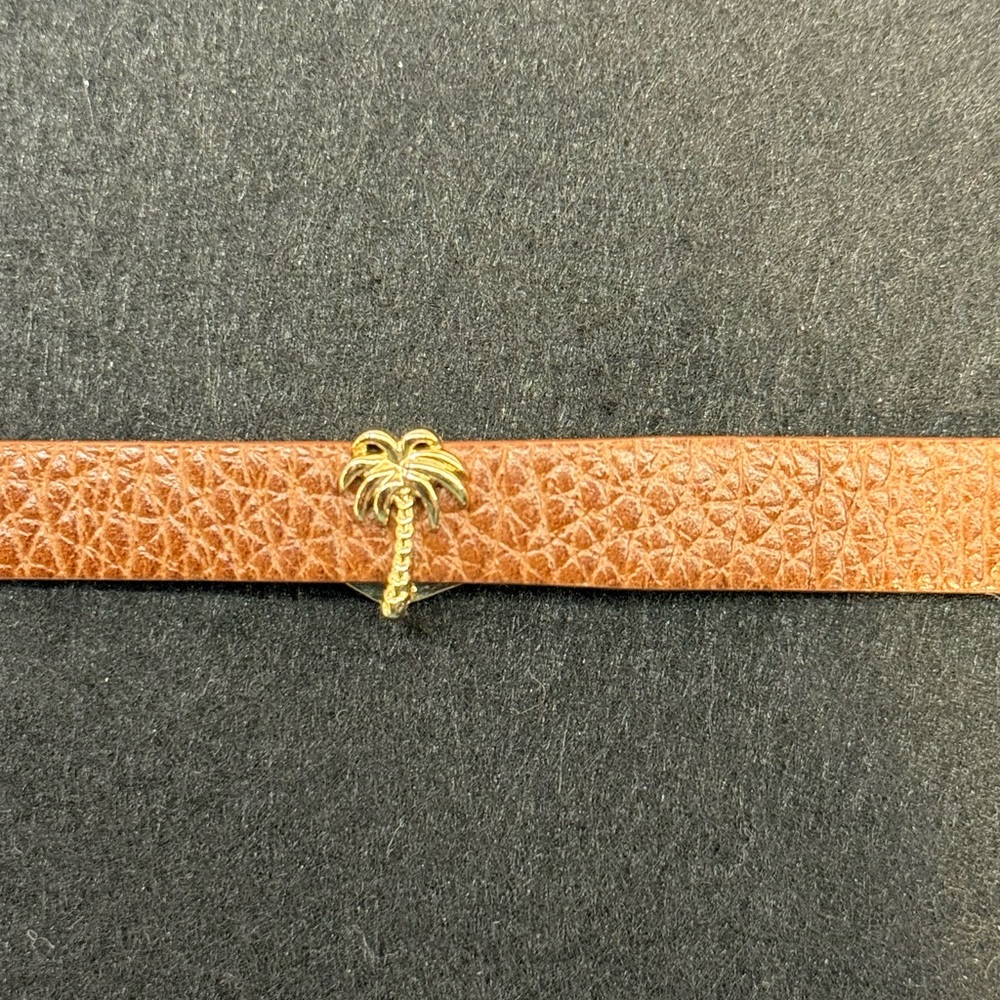 Keep Collective gold palm tree slide on charm.